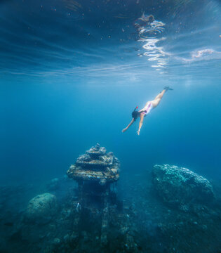 Woman snorkeling exploring the ocean