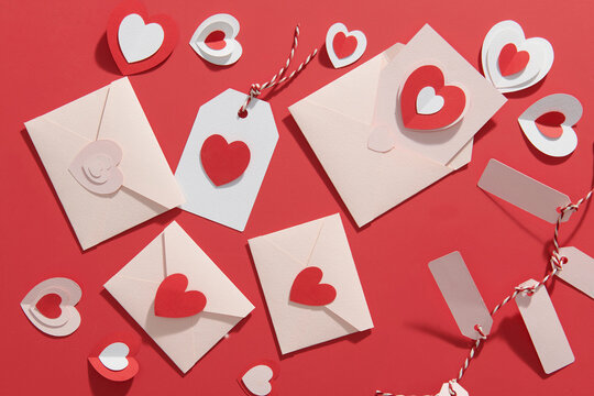 Beautiful composition with paper hearts on color