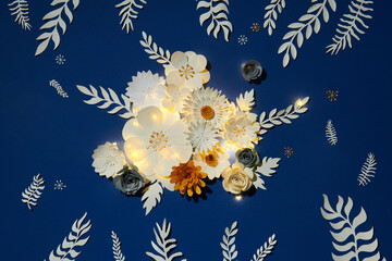 Different beautiful flowers and branches made of paper