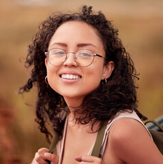 Woman, hiking and portrait with smile for journey, peace and outdoors adventure for exercise. Female person, face and happiness for fitness, wellness and mindset with backpack on summer walk - obrazy, fototapety, plakaty