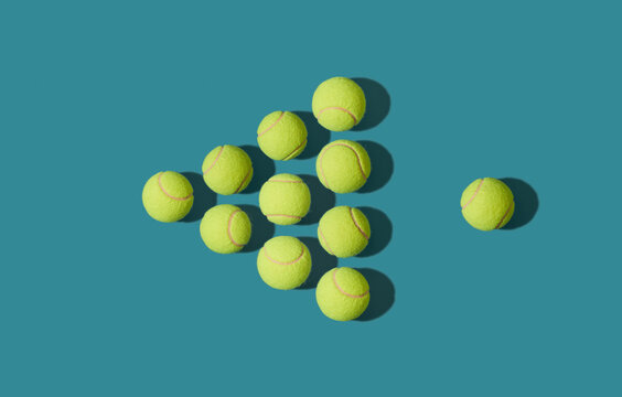 Tennis balls arranged in triangle shape as on billiard game