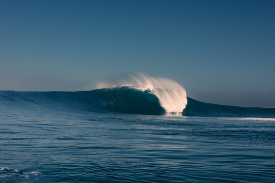 A huge wave breaking over itself in the middle of the Atlantic Ocean