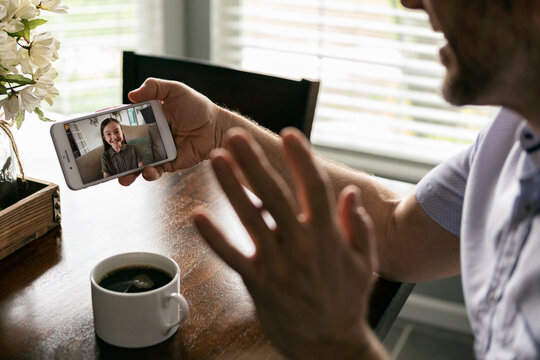 Distancing: Parent Keeps In Touch With Daughter Via Video Chat O