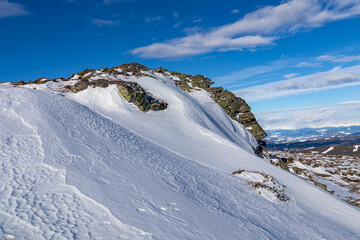 Scenic view of snow covered alpine meadow on hiking trail between Geierkogel and Ladinger Spitz,...