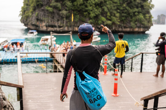 Man on the pier of Phi Phi Islands.