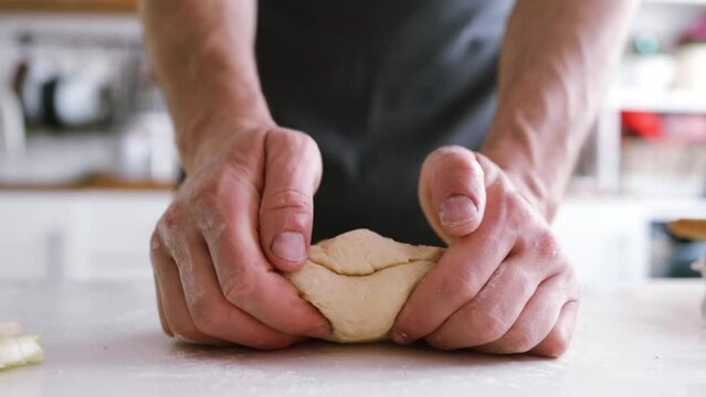 man's hands knead the dough. Ingredients for cooking flour products or dough (bread, muffins, pie, pizza dough). 