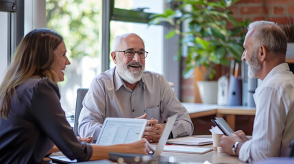 A financial advisor meets with clients in a bright, modern office against a backdrop of investment charts and tables, discussing finance, mortgages and investment strategies. Reflects personal financi