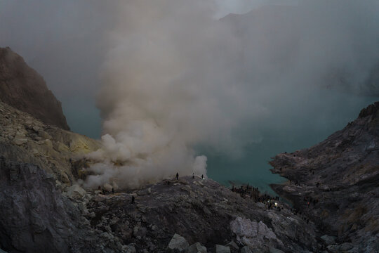 Sulfuric Smoke Rising From a Volcanic Lake at Dusk