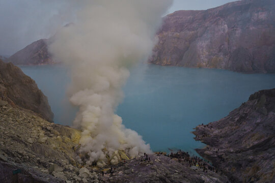 Sulfuric Smoke Rising From a Volcanic Lake at Dusk