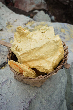 Stack of sulfur ore rocks, open mining in volcano crater