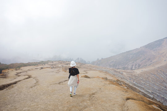 Female Travel Walking Over Mountains Trail Misty Landscape at Dawn