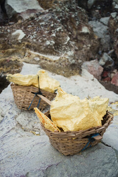 Stack of sulfur ore rocks, open mining in volcano crater