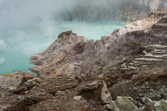 Scenic view of a blue acid lake in volcano's crater