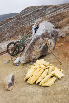 Stack of sulfur ore rocks, open mining in volcano crater