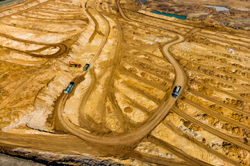 Aerial view of a sand quarry, loading sand into dump trucks