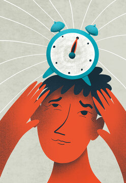 A person holds a blue alarm clock on his head