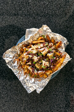 Fries Topped With Butter Poached Lobster And Cheese Sauce