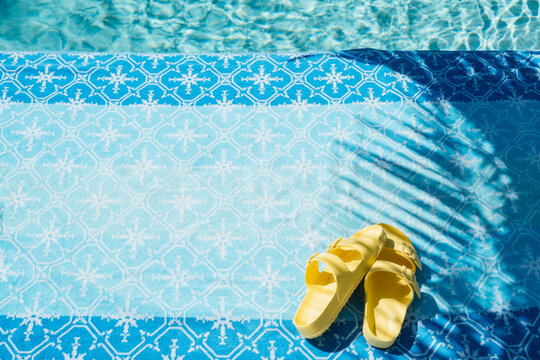 Pool with towel and sandals 