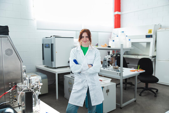 Portrait confident Female scientist in laboratory