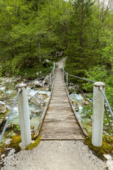 Soča, Bovec, Slovenia. Valley with rapid rivers surrounded by woods. Tibetan wooden bridges. Area for sporting activities such as rafting. Walking and trekking. Amazing turquoise and emerald water.