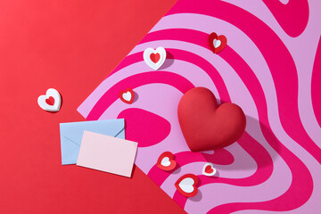 Paper handmade greeting card with red and pink hearts