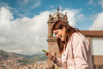 Happy Woman Using her Cellphone in Cusco Peru