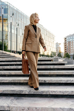Ambitious businesswoman down steps