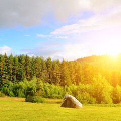 Mountain meadows, haystacks and sun. Carpathians, Ukraine. - 789599465