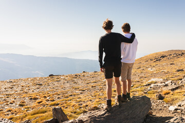 Friends observing mountain view