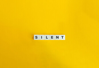 Silent Word. Text on Block letters on bright orange background. Minimal aesthetics. - obrazy, fototapety, plakaty