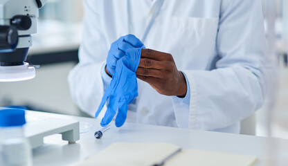 Gloves, hand and book in lab and medicine, innovation and future of healthcare with science and research. Workplace, safety and expert of pharmaceutical, working and notebook for discovery of cure