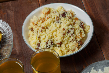 Couscous with dried fruits and nuts on the festive table.