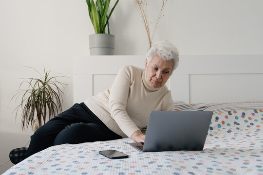 Beautiful Senior Lady Using Her Laptop At Home