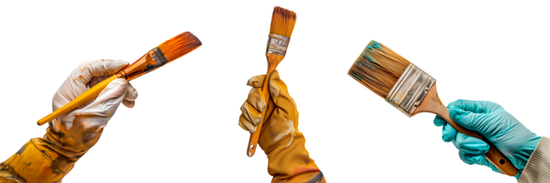 Set of brushes in a gloved hand isolated on a white or transparent background. Close-up of a brushes in hand, front view. Home renovation, artistic creativity. Graphic design element.