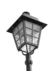 Street light with dual lanterns illuminating the night against a white backdrop