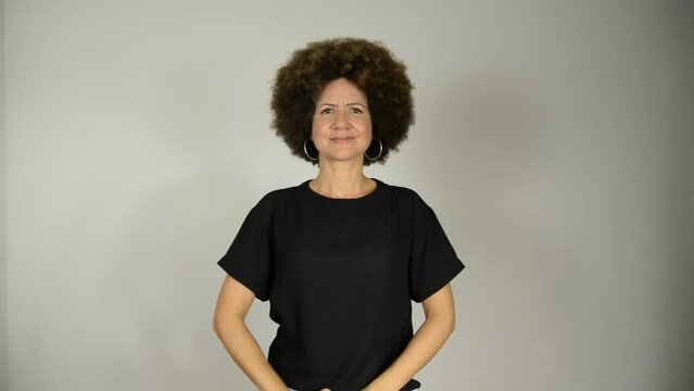 Female interpreter says the phrase everyone deserves respect in Brazilian sign language.