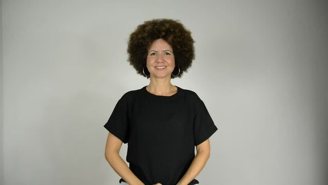 Female interpreter saying good afternoon in Brazilian sign language.