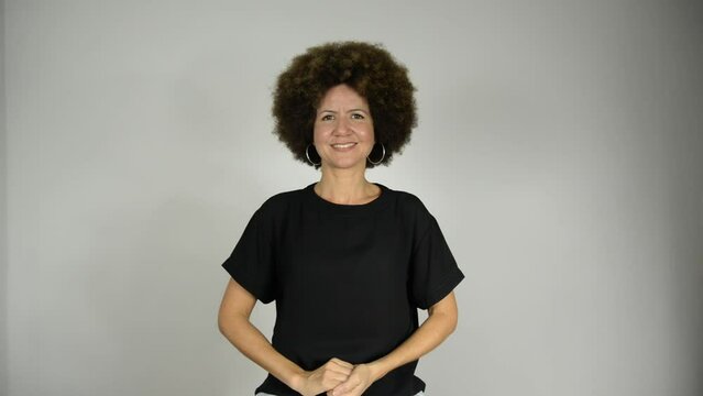 Female interpreter saying hugs in Brazilian sign language.