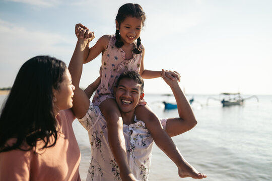 Family having fun at the beach in Bali