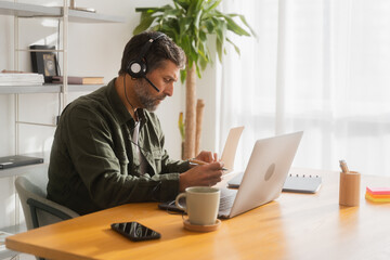 Mature Man Working In Home Office