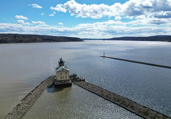 rondout lighthouse in kingston new york (aerial photo of small light house at confluence of hudson river and rondout creek) valley, mountains, dramatic sky