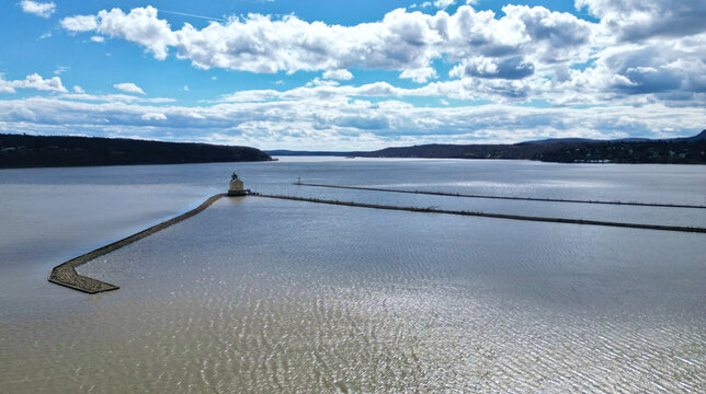 rondout lighthouse in kingston new york (aerial photo of small light house at confluence of hudson river and rondout creek) valley, mountains, dramatic sky