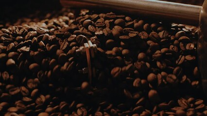 Fragrant coffee beans are roasted, hot aroma coffee seeds. Coffee production. Macro shot