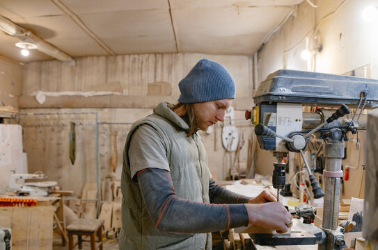guitar maker working on making an instrument