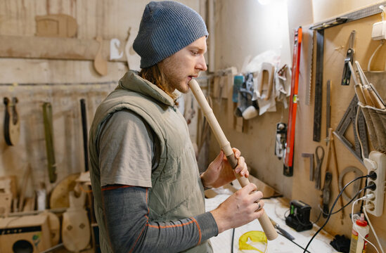 guitar master tuning the instrument