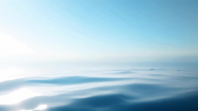 Serene ocean horizon with soft light gradient and gentle ripples.