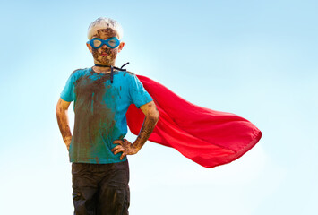 Portrait, confident and superhero child outdoor with wind on cape, goggles and mockup on blue sky...