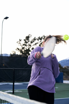 woman avoiding the ball pickleball