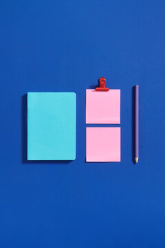 composition of colorful notebooks and paper notes. Top view.