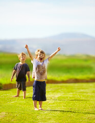 Dirt, winner and celebration of child for games by grass, lawn and outdoor playing with happiness...